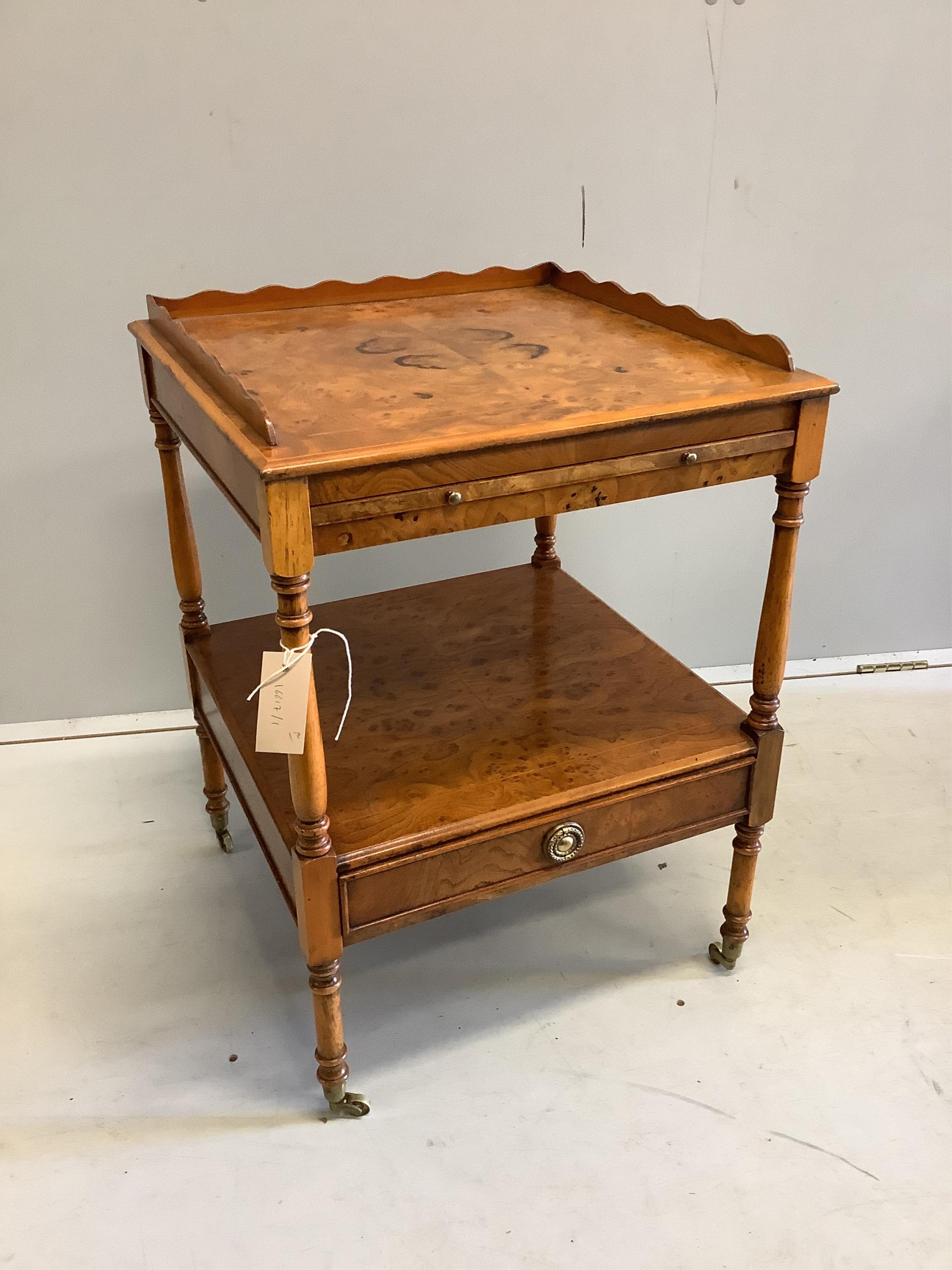 A pair of reproduction burr elm two tier bedside tables fitted slides, width 46cm, depth 46cm, height 64cm. Condition - fair, surfaces have worn areas.